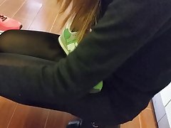 Sexy store girl in shiny black tights