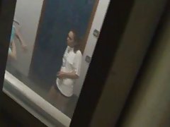 Sporty girls changing and showering in locker room