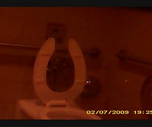 Bathroom spy Short Haired Milf