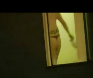 Neighbor spied topless in her bedroom