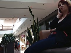 Mature woman sitting on mall bench