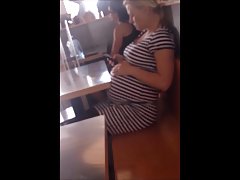 Blonde Pregnant Milf up skirt with panties stockings.