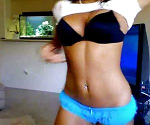 brunette stripping in front of webcam