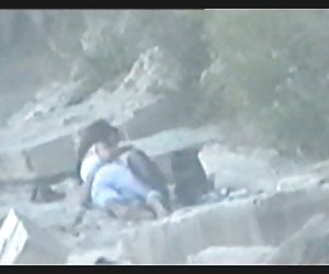 teen couple caught on the beach