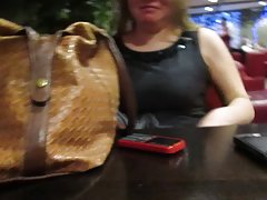 girl showing stockings on and under the table